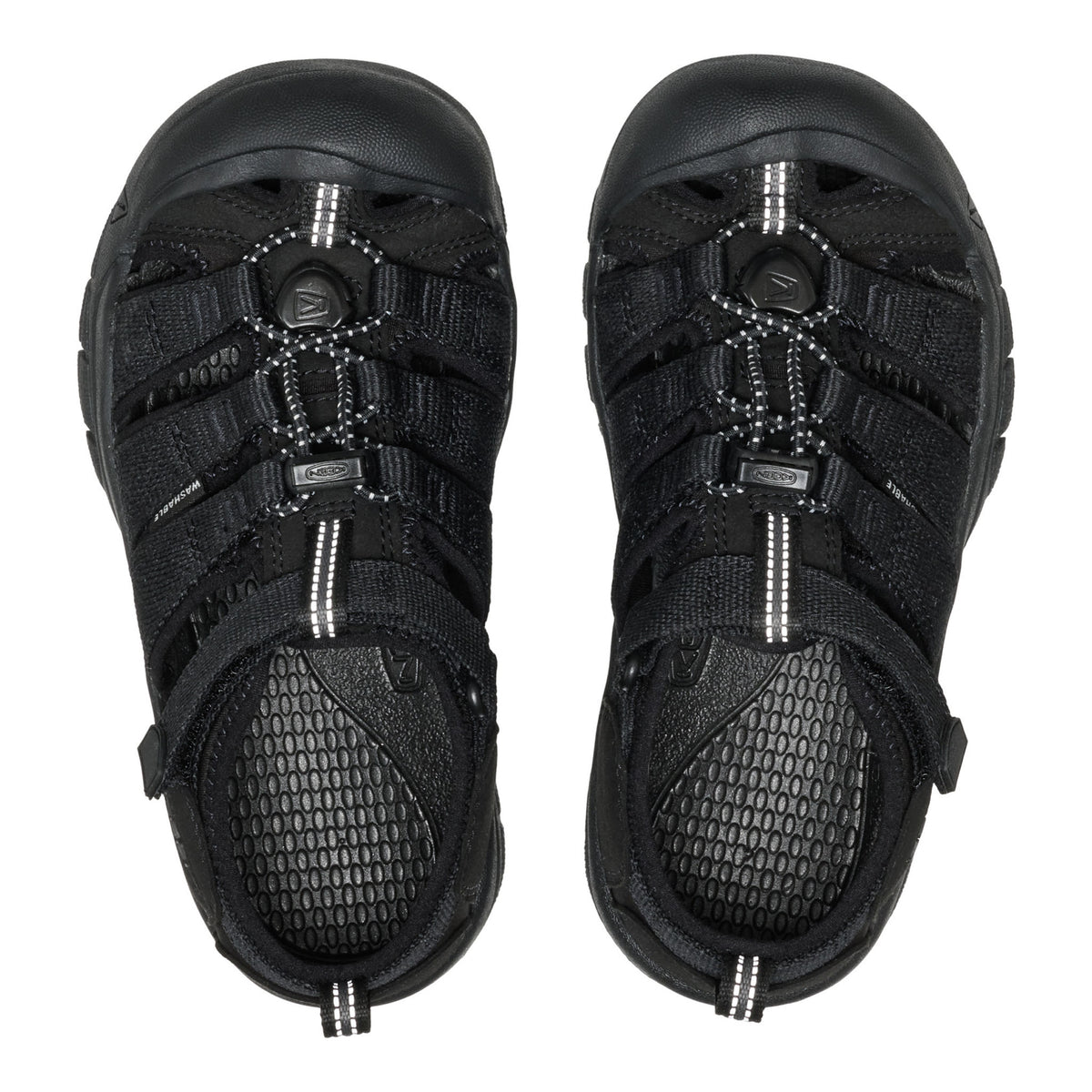 Black sandals with multiple straps on a white background