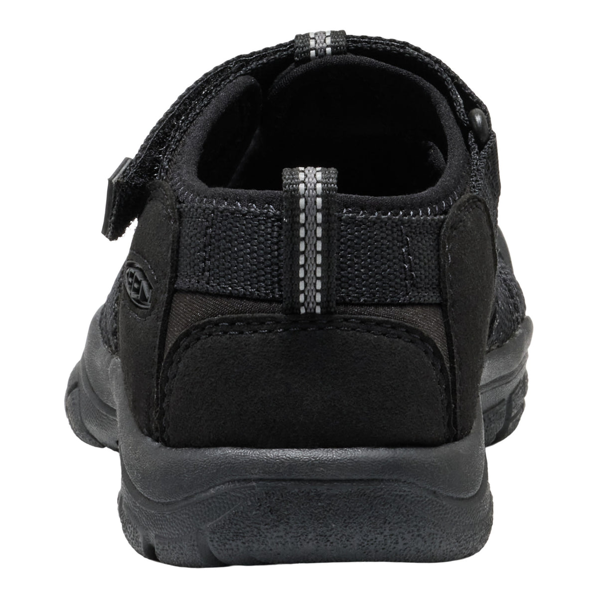 Black sandal with a strap on a white background