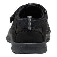 Black sandal with a strap on a white background