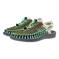 Pair of sandals with braided design on a white background