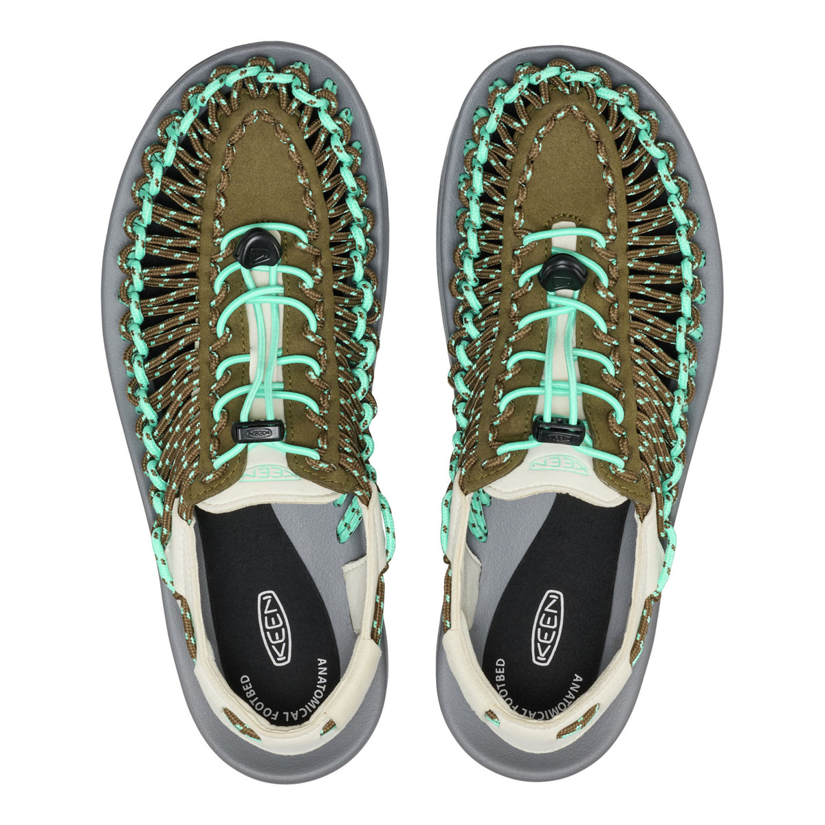 Pair of KEEN sandals with green laces on a white background