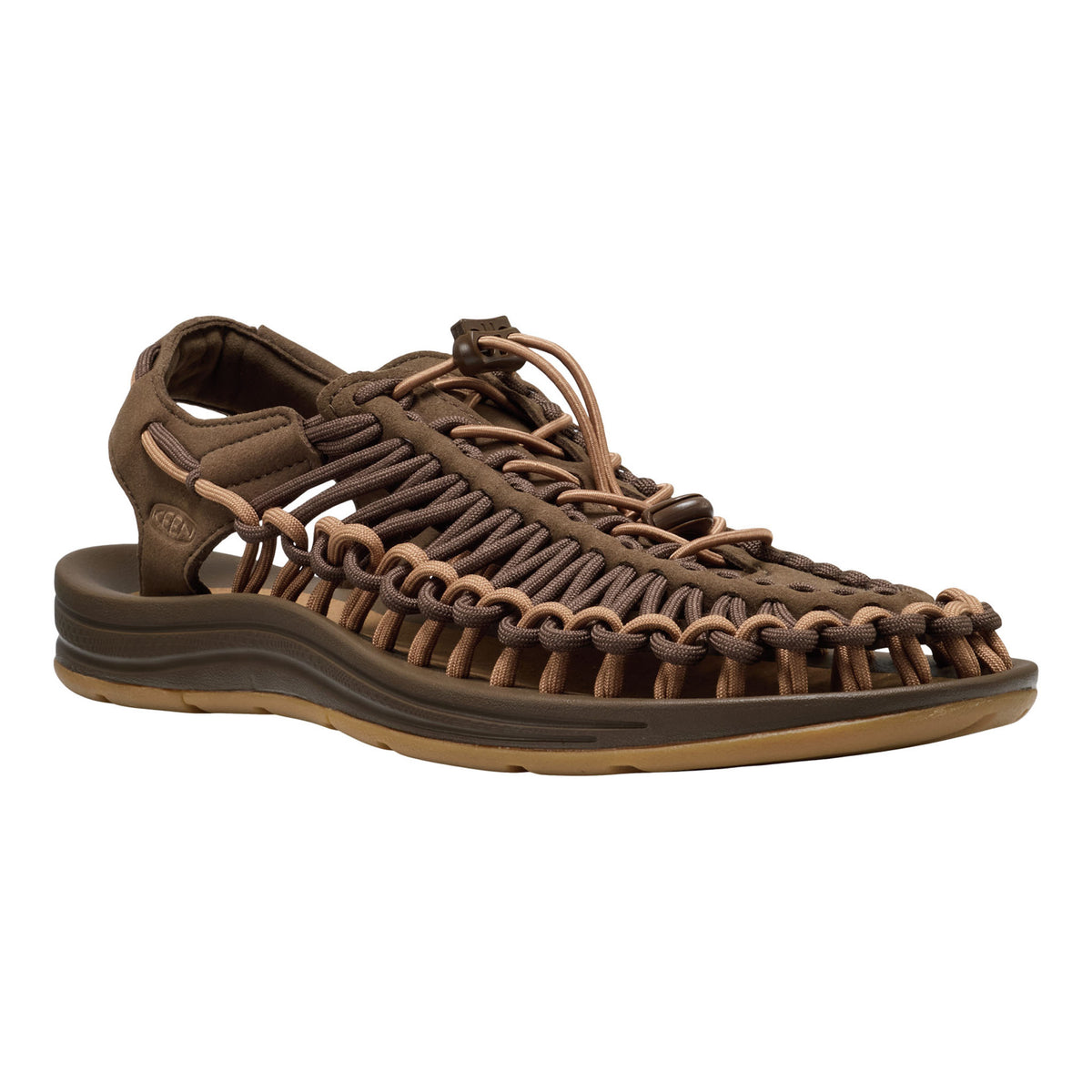 Brown sandal with braided straps on a white background