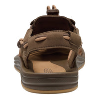 Brown sandal with multiple straps on a white background