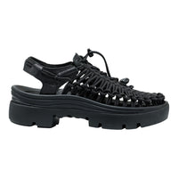 Black woven sandal with thick sole on a white background