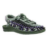 A single women's platform sandal in olive green with black and purple woven straps, shown from a side profile on a white background.