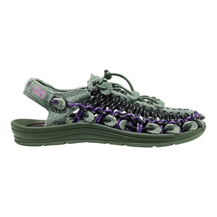 A single Teendoo sandal in olive green and purple, featuring a textured woven upper with purple accents and a matching green sole, shown against a plain white background.