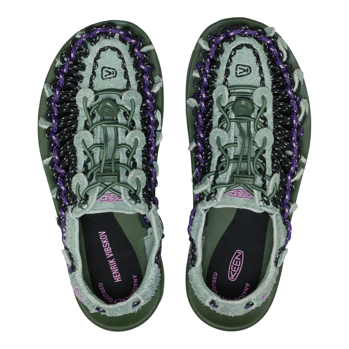 Pair of green and purple Keen sandals on a white background