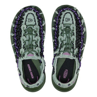 Pair of green and purple Keen sandals on a white background