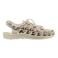 KEEN sandal shown in profile against a plain white background. The sandal features a textured, woven upper made of beige, brown, and white elements, with a matching beige sole and heel strap.