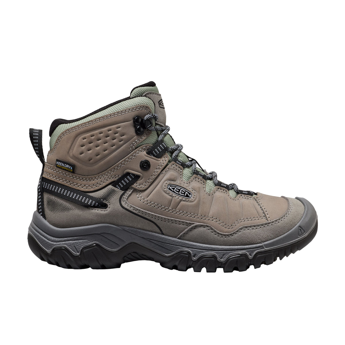 Brown hiking boot with black sole on a white background