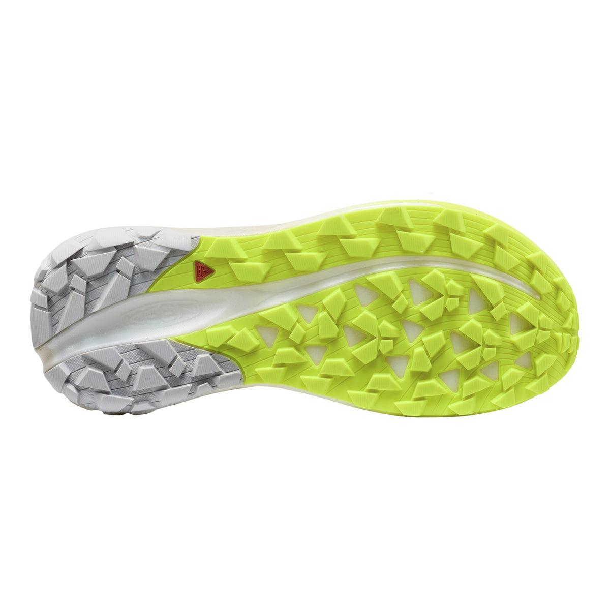 Close-up of a running shoe sole with green tread pattern on a white background