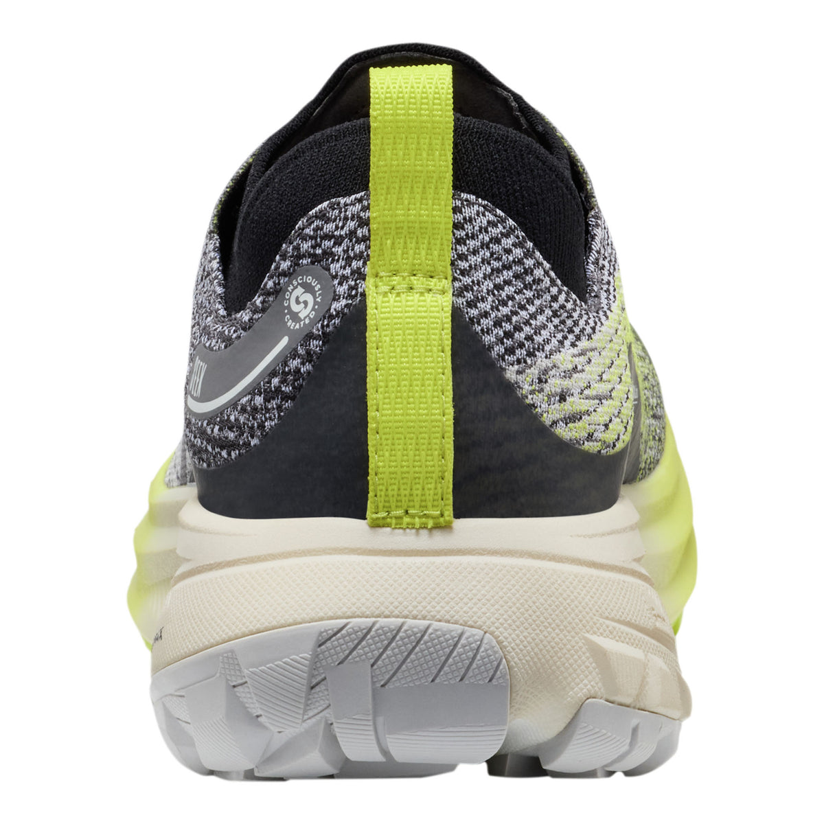 Back view of a running shoe with a green strap on a white background