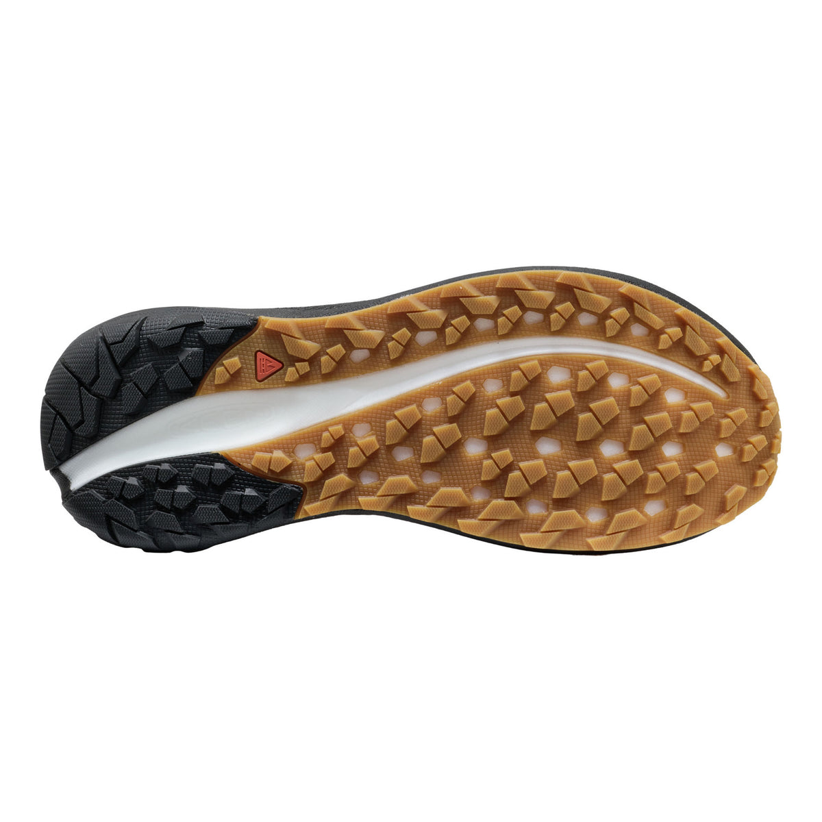 The outsole of a trail running shoe, showing a black sticky rubber heel and toe with a tan gum midsole and a white center stripe, photographed from a top-down view on a white background.