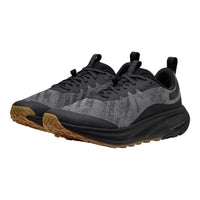 A pair of KEEN trail running shoes in black and gray with a brown gum outsole, shown from a three-quarters angle on a white background.