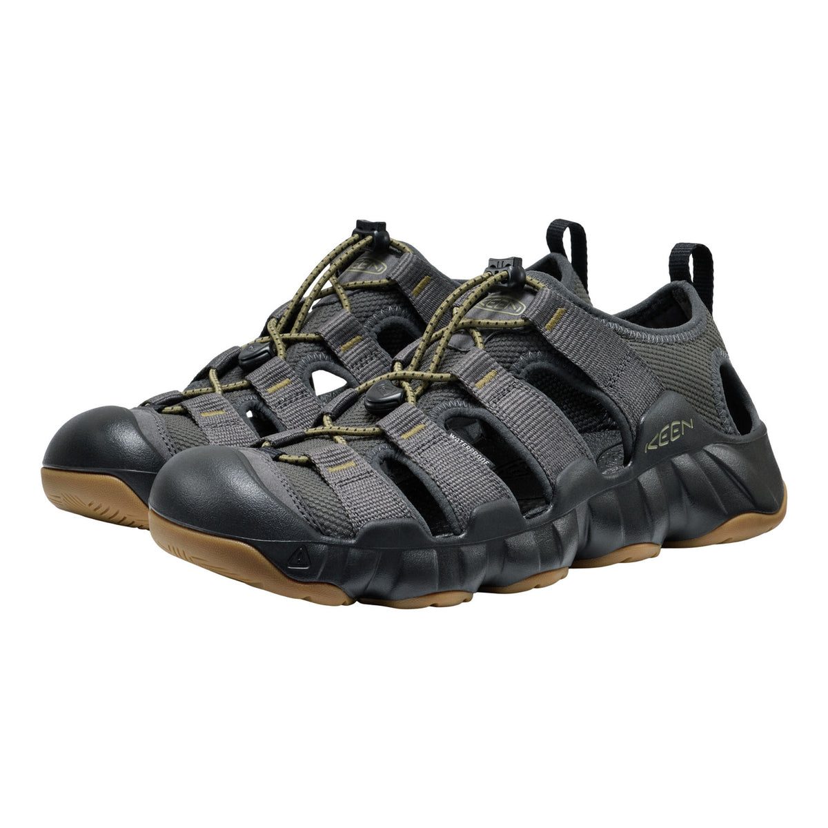 Pair of gray sandals with brown soles on a white background