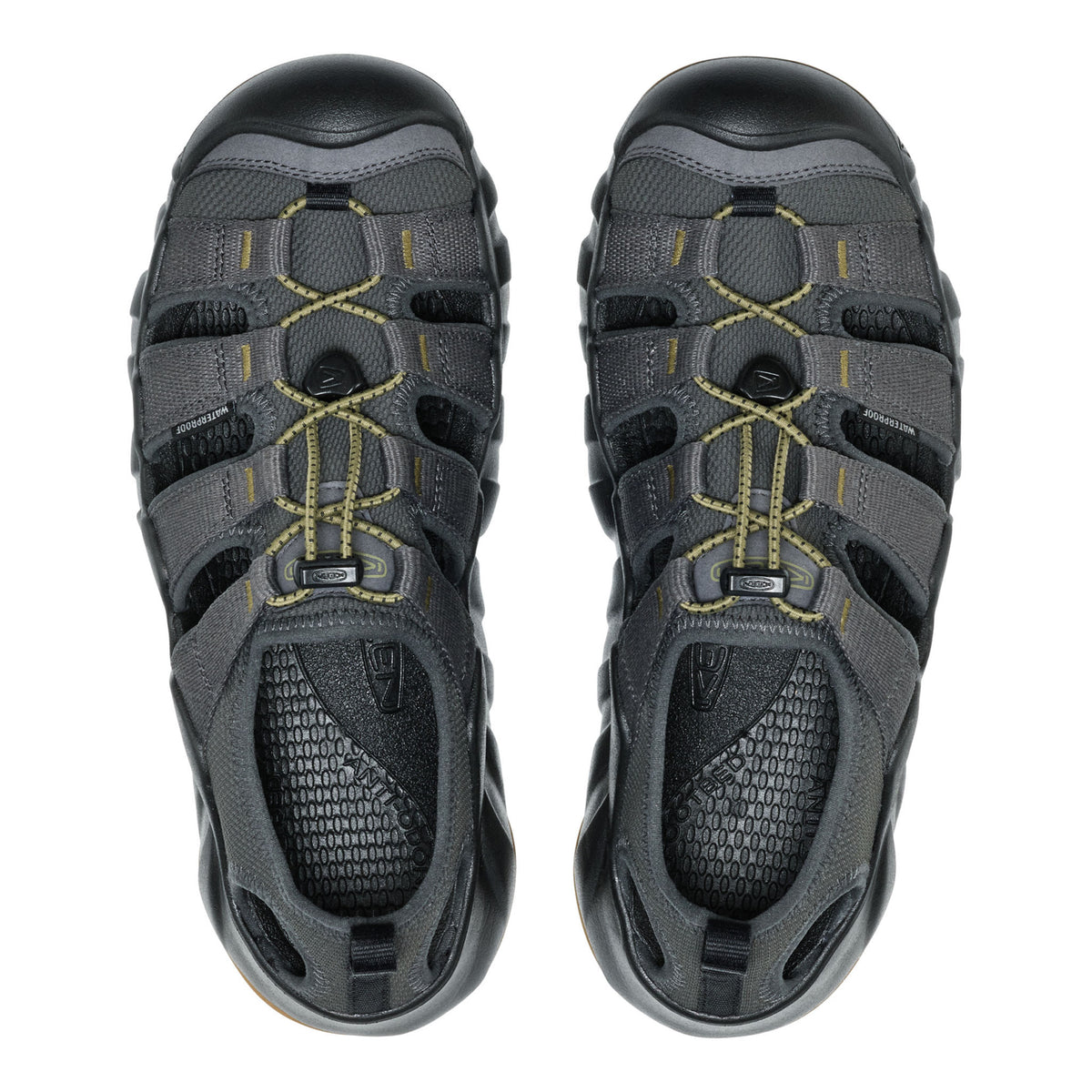 Pair of gray sandals with black soles on a white background