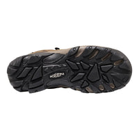 Black sole of a sandal with 'Keen' branding on a white background