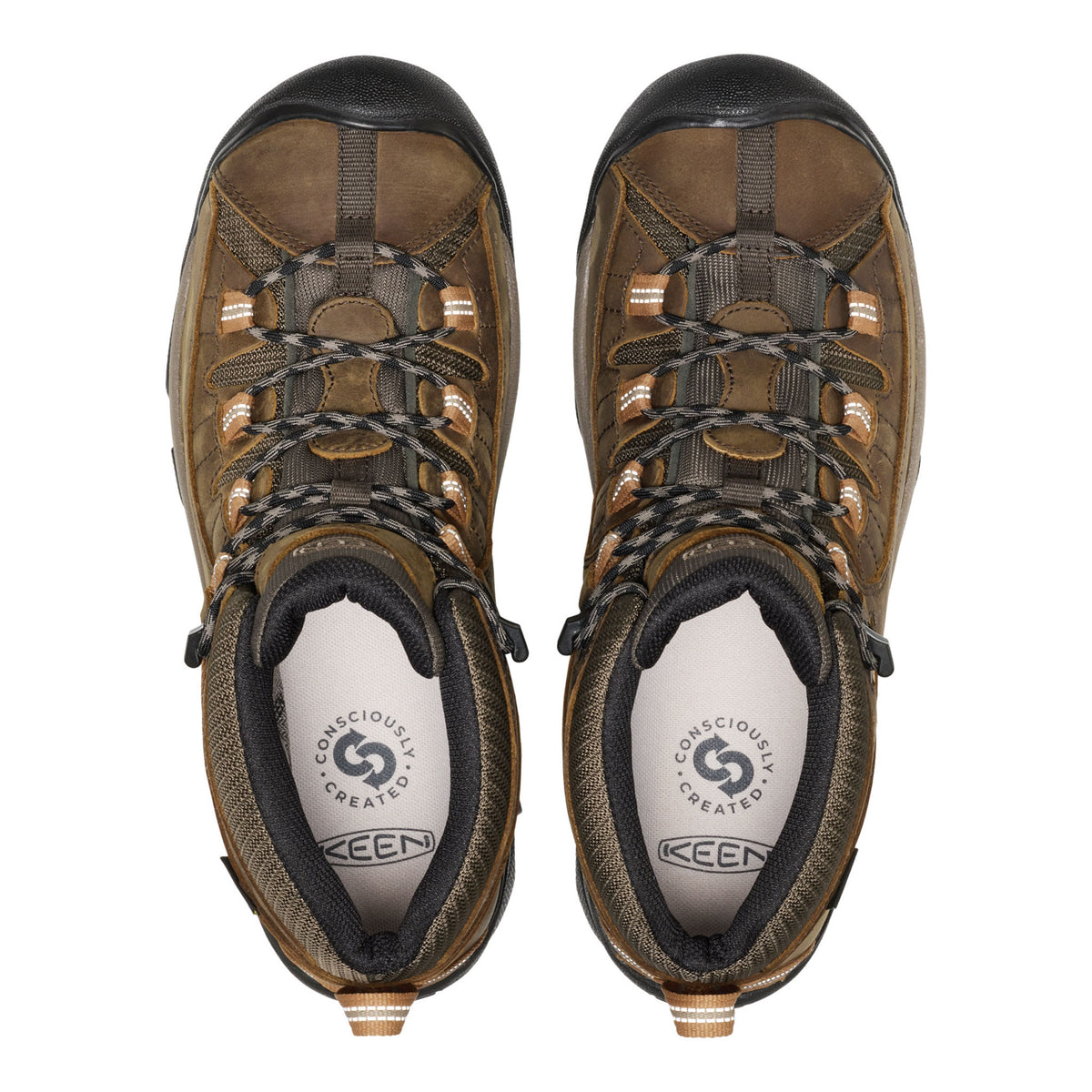 Pair of brown hiking boots with black soles on a white background