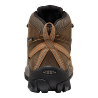 Brown hiking boot with black sole on a white background