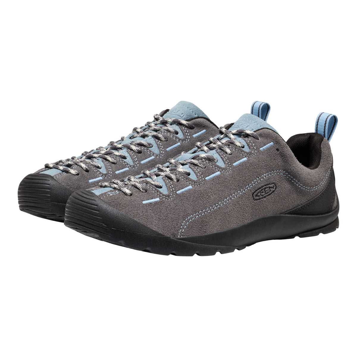 A pair of Keen outdoor shoes in grey suede and black rubber, featuring light blue accents on the laces, stitching, and heel pull tabs, shown against a plain white background.
