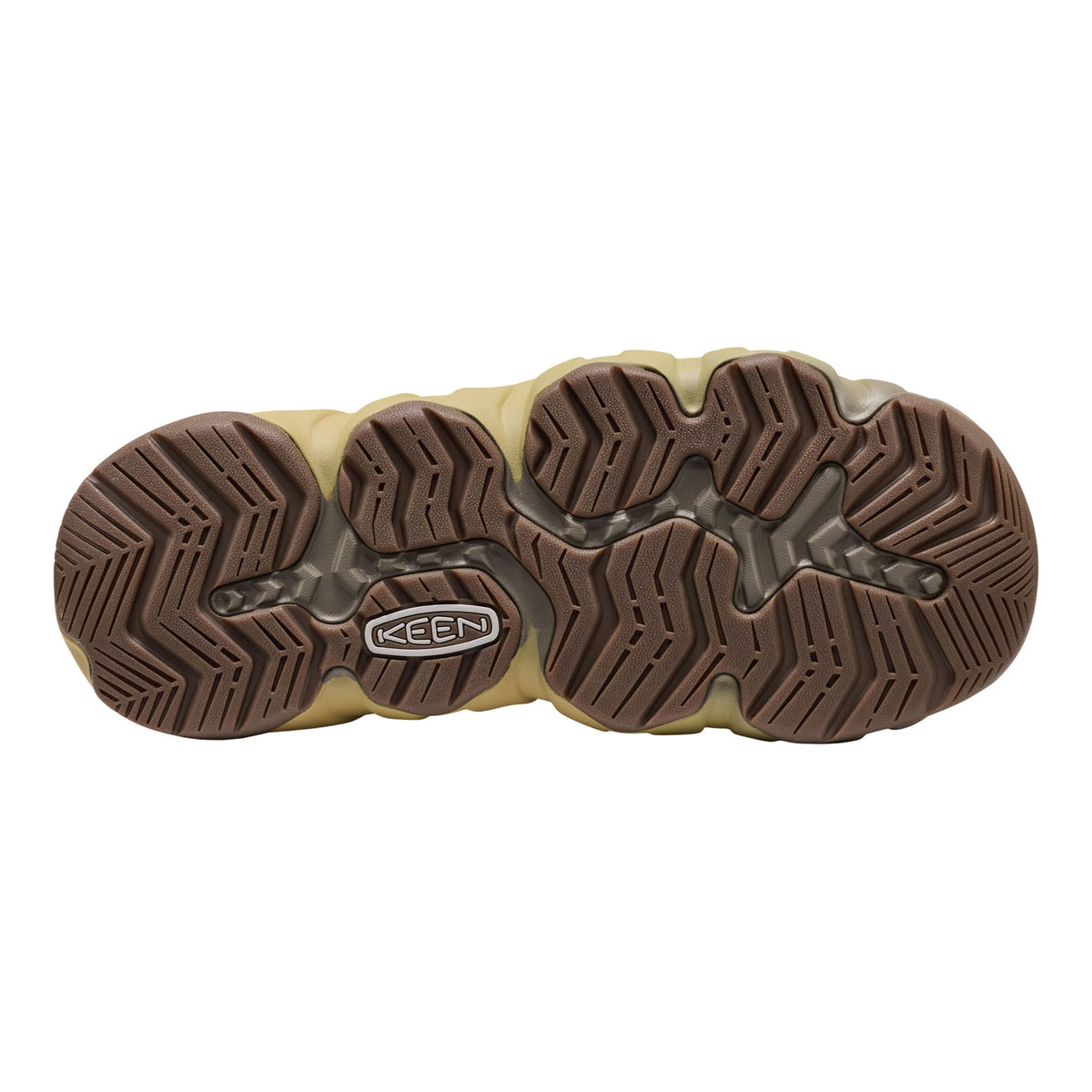 The bottom sole of a Keen boot, featuring a brown treaded outsole with a beige midsole and a visible Keen logo.