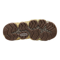 The bottom sole of a Keen boot, featuring a brown treaded outsole with a beige midsole and a visible Keen logo.