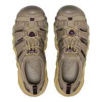 A pair of Keen outdoor water shoes in a muted taupe and khaki colourway with light tan laces and small dark purple accents on the laces and heel pull tabs, shown from a top-down view on a white background.