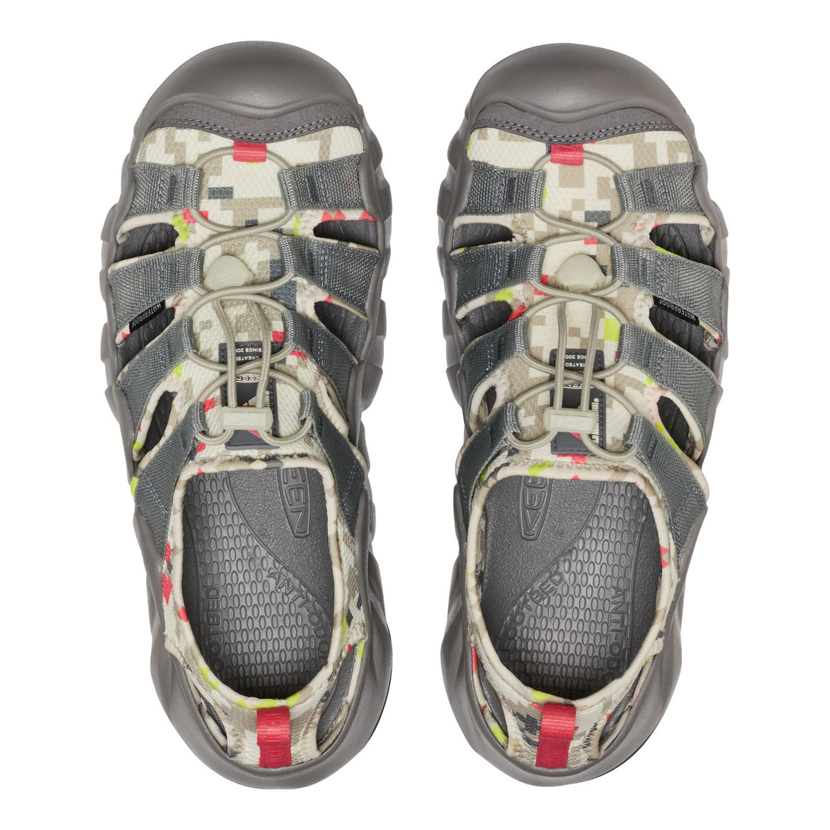 A pair of Keen water shoes shown from a top-down view, featuring a gray and beige digital camouflage pattern with small red and lime green accents.