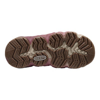 The outsole of a Keen hiking boot in dusty rose pink and brown, showing the tread pattern and the Keen logo on a white background.