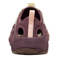 A close-up rear view of a water shoe in dusty purple and light pink, featuring a knit upper, cutout design, and a pull tab.
