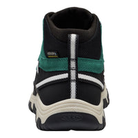 A high-top shoe shown from the back, featuring a black mesh upper with teal green and white accents, a thick off-white midsole, and a black and white outsole.