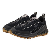 A pair of black KEEN Jasper Zionic shoes with brown lugged soles and subtle gray camouflage details on the tongue and laces, shown against a plain white background.