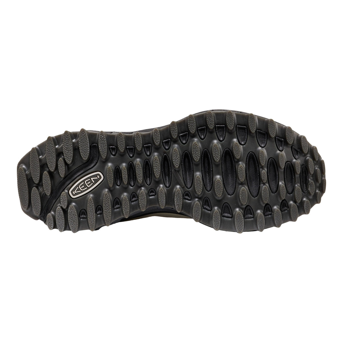 Black shoe sole with tread pattern on a white background