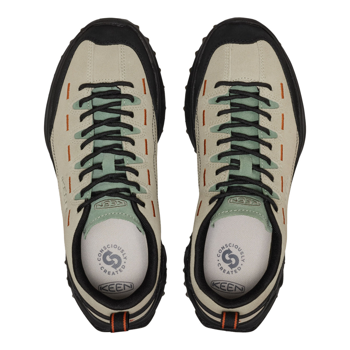 A pair of KEEN shoes shown from a top-down view, featuring a light beige suede upper, black rubber toe caps and soles, black laces, and sage green accents on the laces and collar lining.