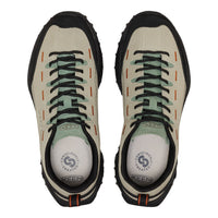 A pair of KEEN shoes shown from a top-down view, featuring a light beige suede upper, black rubber toe caps and soles, black laces, and sage green accents on the laces and collar lining.
