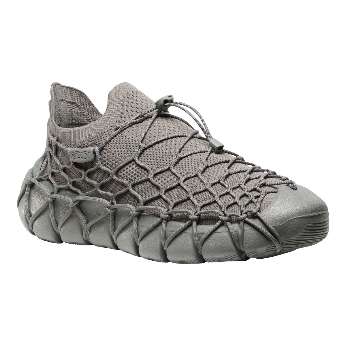 A single gray slip-on mesh sneaker with a unique crisscross woven strap design across the upper and a chunky sculpted sole, shown against a plain white background.