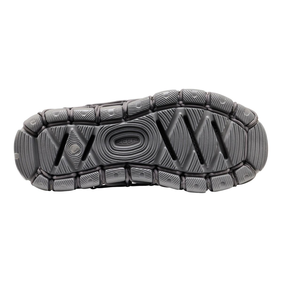 The textured black rubber outsole of a shoe, showing the tread pattern and embossed KEEN branding, isolated on a white background.