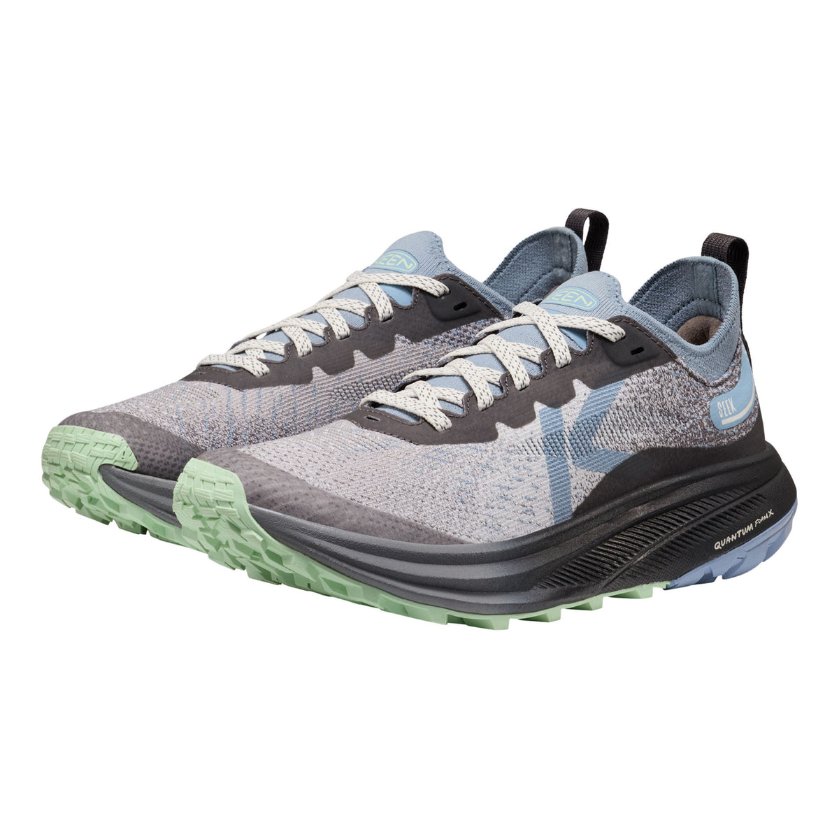 A pair of KEEN running shoes in grey, black, and light blue, featuring a textured knit upper, light gray laces, and a green and black rugged outsole.