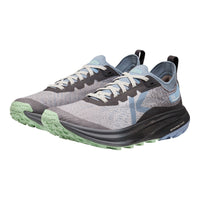 A pair of KEEN running shoes in grey, black, and light blue, featuring a textured knit upper, light gray laces, and a green and black rugged outsole.