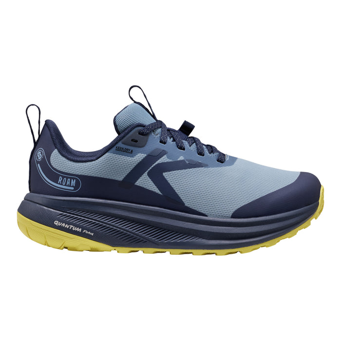 A single athletic trail running shoe shown in profile against a solid white background. The shoe features a light blue-gray mesh upper with navy blue overlays, a thick navy midsole, and a bright yellow outsole.