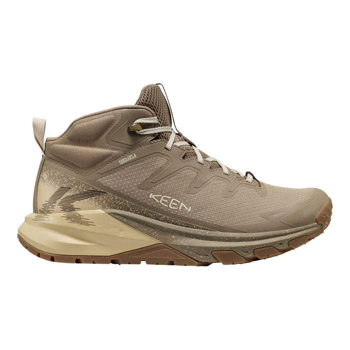 A Keen hiking boot in a warm taupe and beige colorway, featuring a lace-up design, textured synthetic and mesh upper, and a thick beige and brown sole, shown against a plain white background.