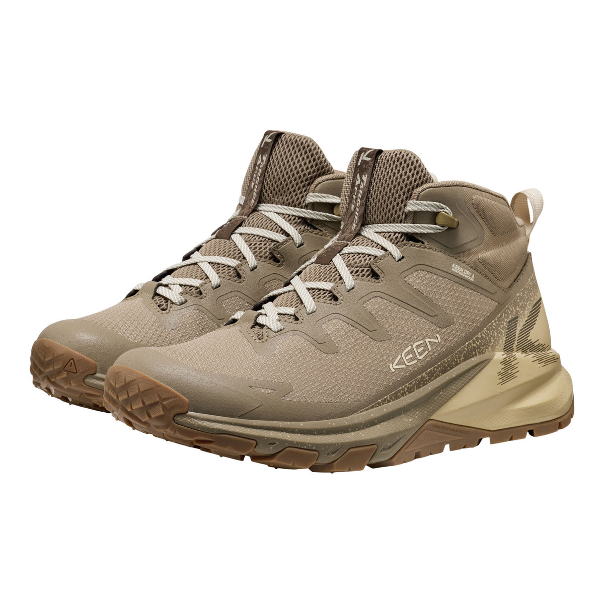 A pair of KEEN mid-top hiking boots in a desert sand colorway, featuring a textured mesh upper, lace-up front, and rugged sole, shown against a plain white background.