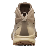 A single hiking boot shown from the rear three-quarter view, featuring a beige and brown color palette with a textured midsole and pull tab.