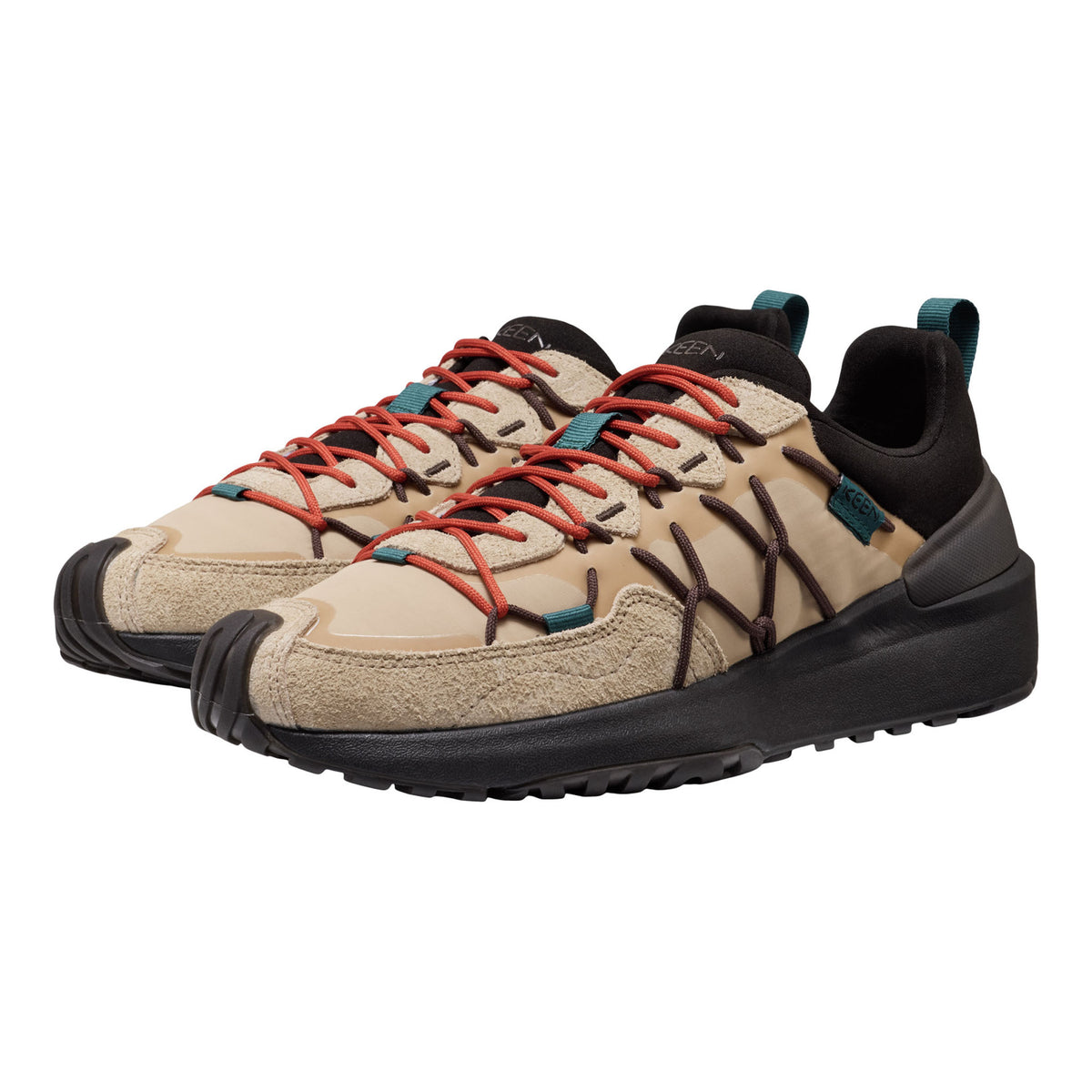 A pair of outdoor hiking shoes in beige and black with bright red laces and small teal accents, shown on a plain white background.