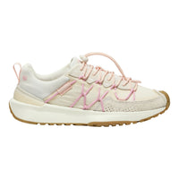 A low-top sneaker in off-white and light pink, featuring textured mesh and suede panels, pink laces, and a gum-colored outsole, shown from a side profile on a white background.