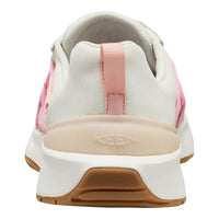 A close-up rear view of a KEEN sneaker in off-white canvas with a light pink heel tab and side accents, featuring a beige midsole and a brown gum outsole.