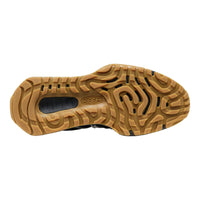 The textured tan rubber outsole of a Keen shoe, showing the brand logo embossed in the center, photographed on a solid white background.