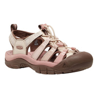 A Keen women's sandal in light beige and dusty pink, featuring a brown sole and heel, shown from a side profile on a white background.