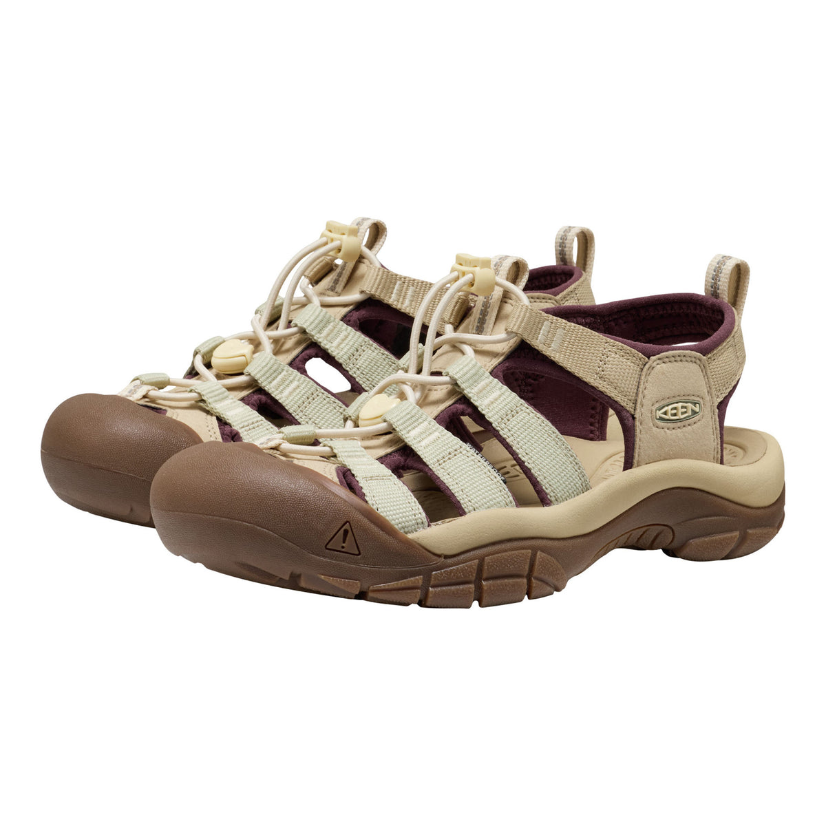 Keen brand women's hiking sandals in beige and brown with dark burgundy lining, shown against a plain white background.