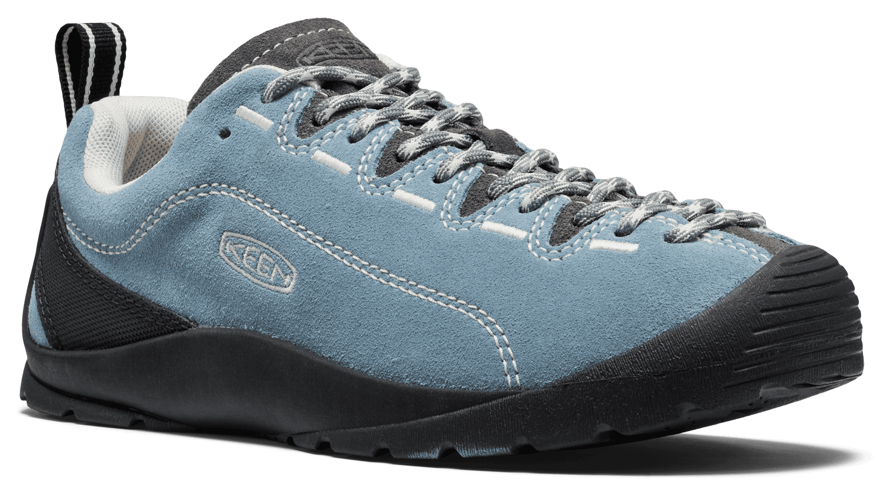 A light blue suede Kenda shoe with black and gray accents, shown from a side profile against a solid green background.